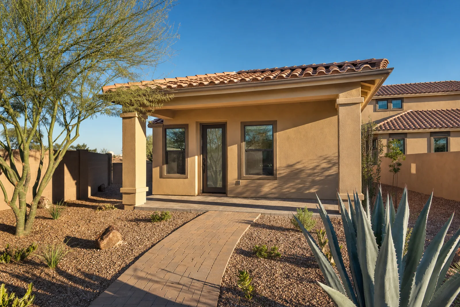 Rendering of a stucco and clay tile casita with a covered patio in a Mesa backyard