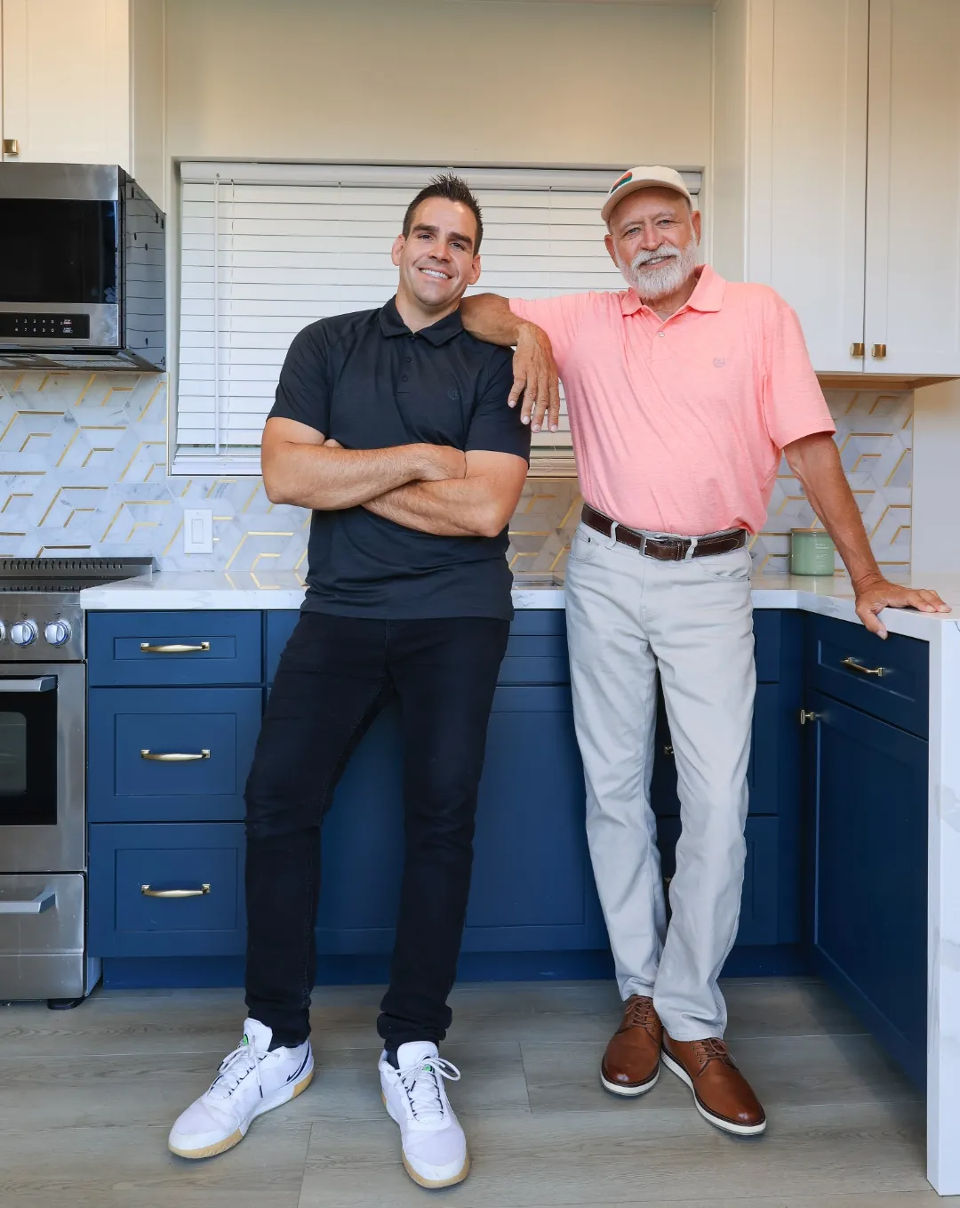 Chris Conover, founder of Tiny Custom House, standing in the finished kitchen of a container home